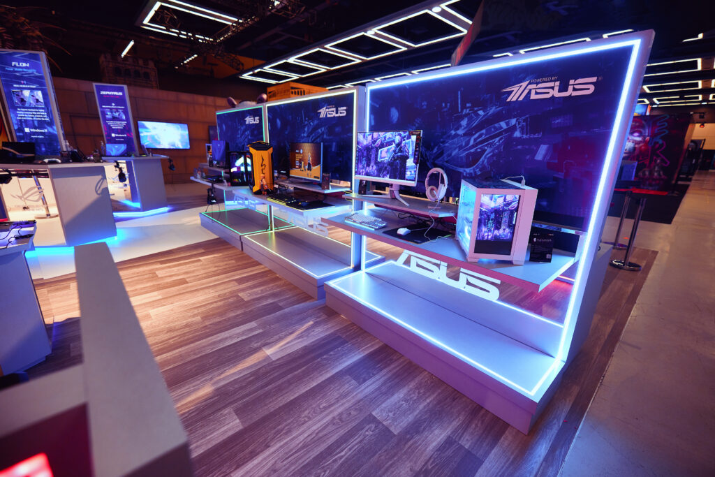 ASUS' interactive booth showcasing cutting-edge computers and innovative tech solutions for the future. Explore the latest in technology with sleek designs and powerful performance, embodying ASUS excellence in every detail