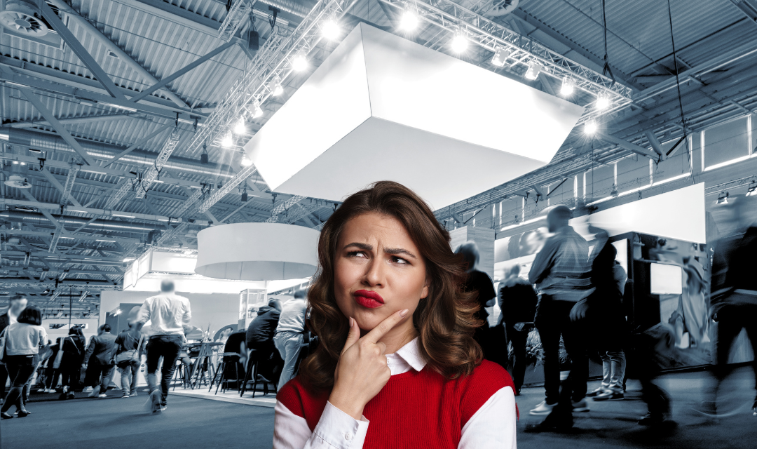 black and white trade show floor with woman in color thinking